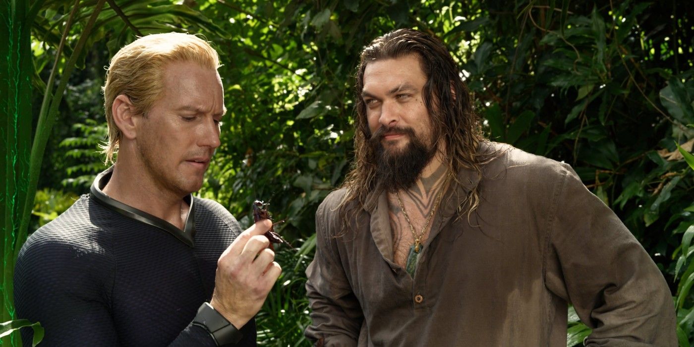 Arthur gives Orm a cockroach to eat in the jungle in Aquaman and the Lost Kingdom