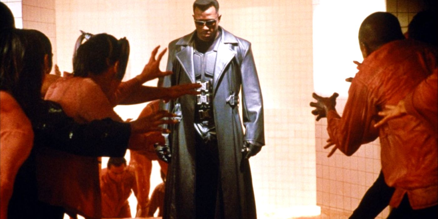Wesley Snipes as Blade about to fight a group of attacking vampires in Blade's blood rave scene