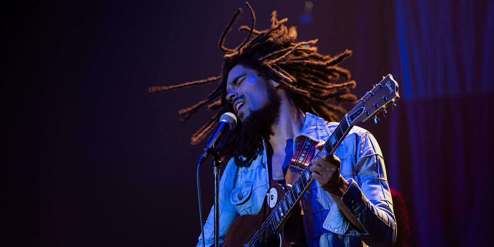 Bob Marley sings and plays guitar in Bob Marley One Love