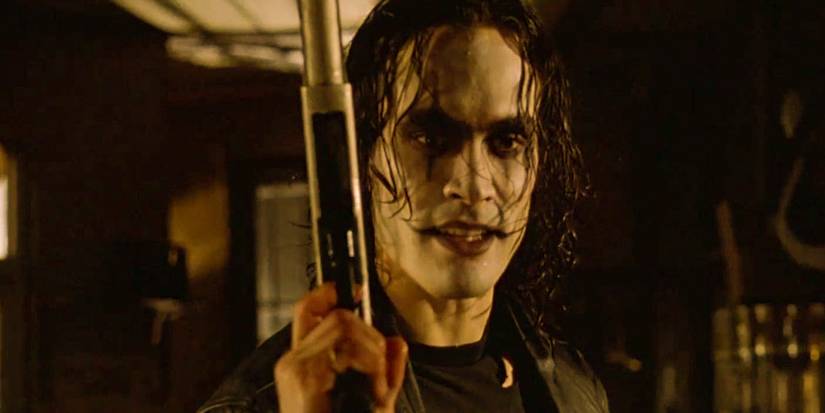 Brandon Lee as Eric Draven with a gun in The Crow 1994