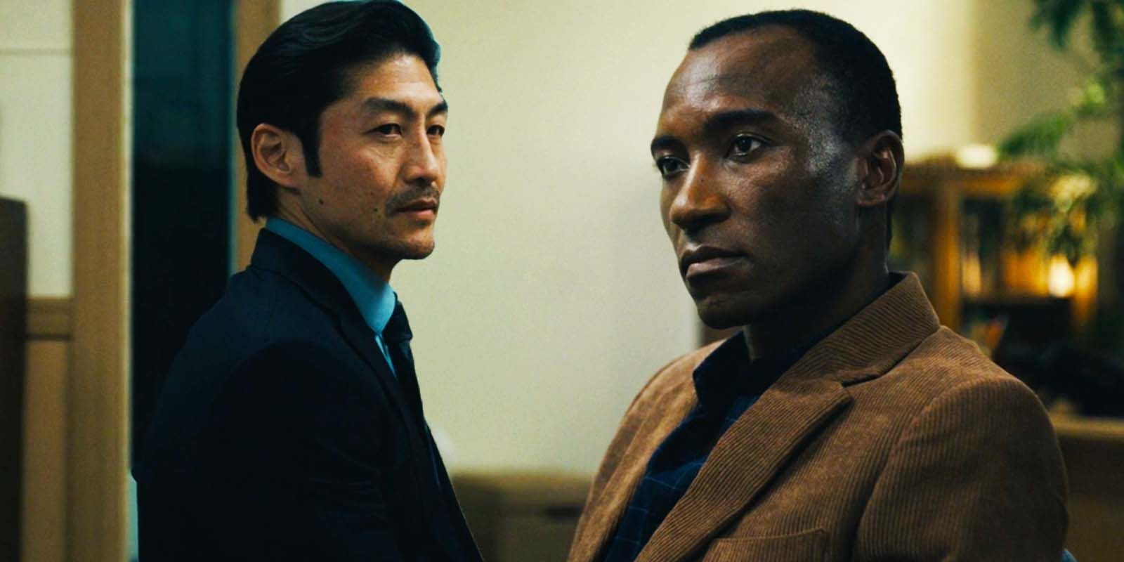 Brian Tee as Clarke Woo and Blessing Mokgohloa as Pastor Alan Mambo in Expats episode 3