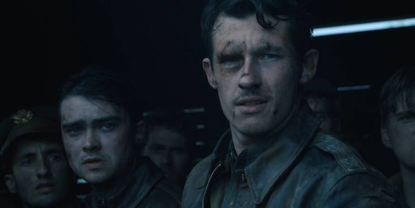 Callum Turner as John Egan looking beaten up with other prisoners of war in Masters of the Air Episode 6