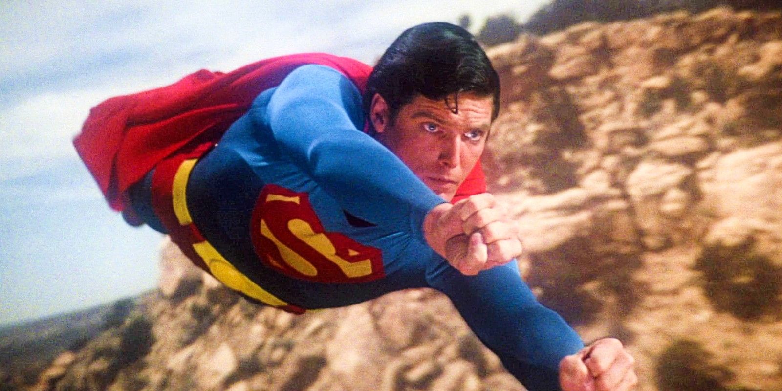 Christopher Reeve In Costume As Superman Flying Past Cliffs In Superman 1978 Movie