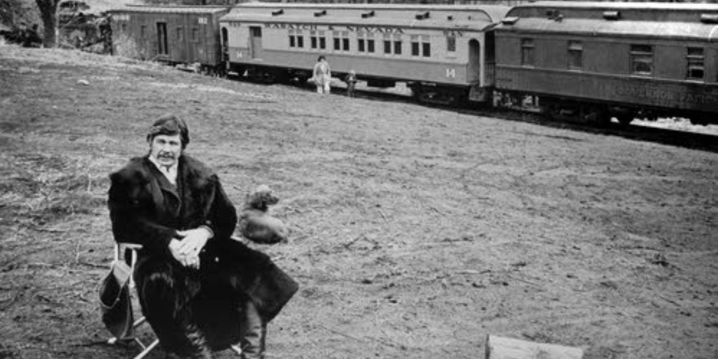 Deakin sentado na frente de um trem em Breakheart Pass