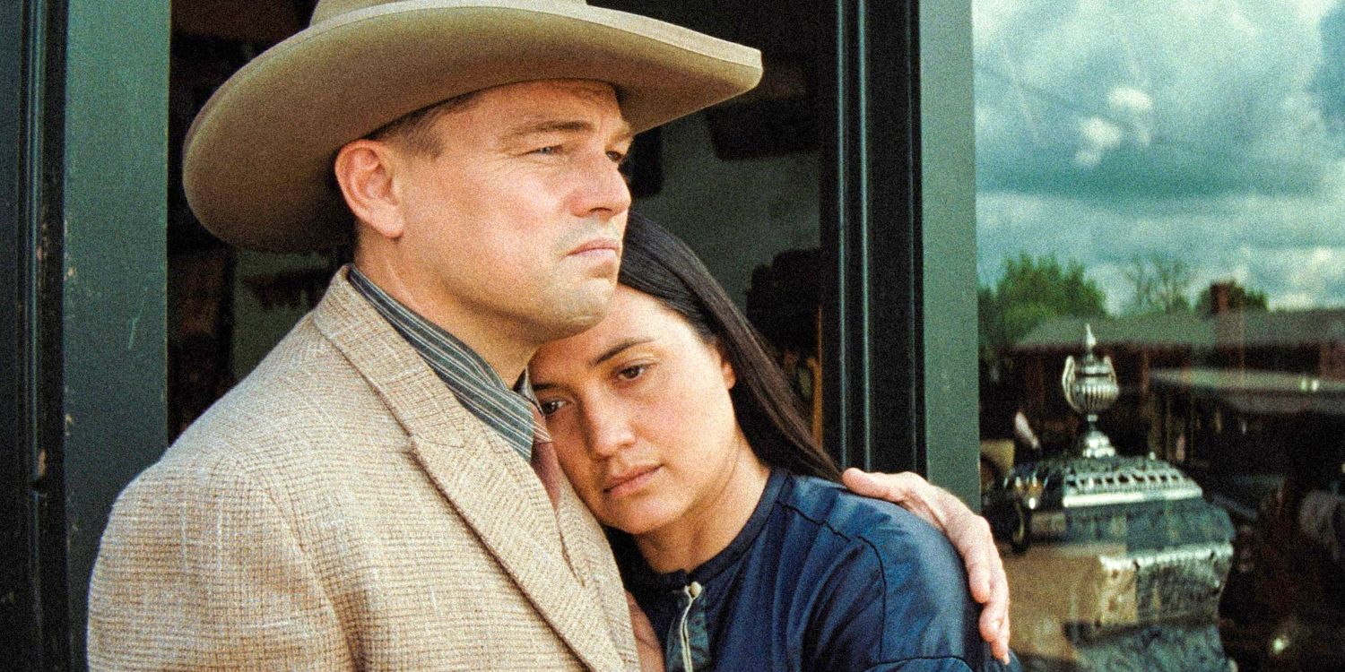 Lily Gladstone as Mollie Burkhart and Leonardo DiCaprio Ernest Burkhart in Killers of the Flower Moon holding each other looking sad