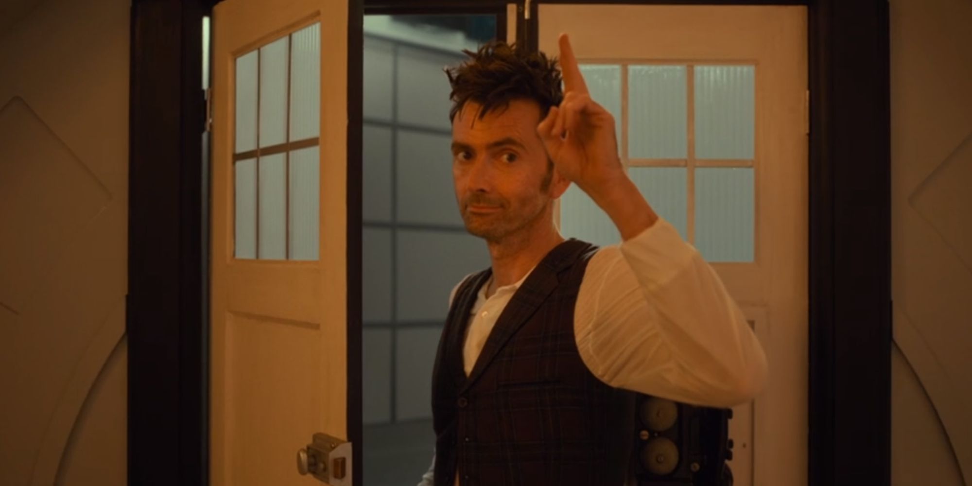 David Tennant as the Fourteenth Doctor saluting as he leaves the TARDIS in Doctor Who