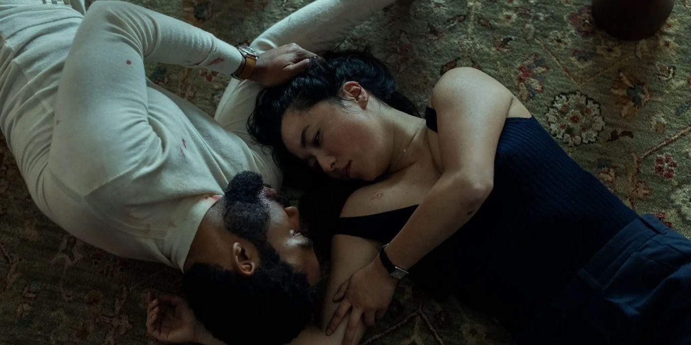 John (Donald Glover) and Jane (Maya Erskine) looking into each other's eyes while laying on the floor in Mr. & Mrs. Smith's finale