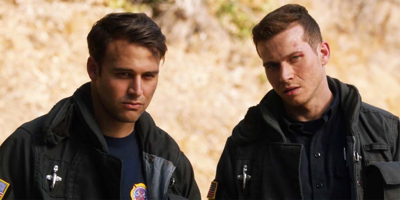 Oliver Stark as Evan "Buck" Buckley and Ryan Guzman as Eddie Díaz looking serious in 9-1-1