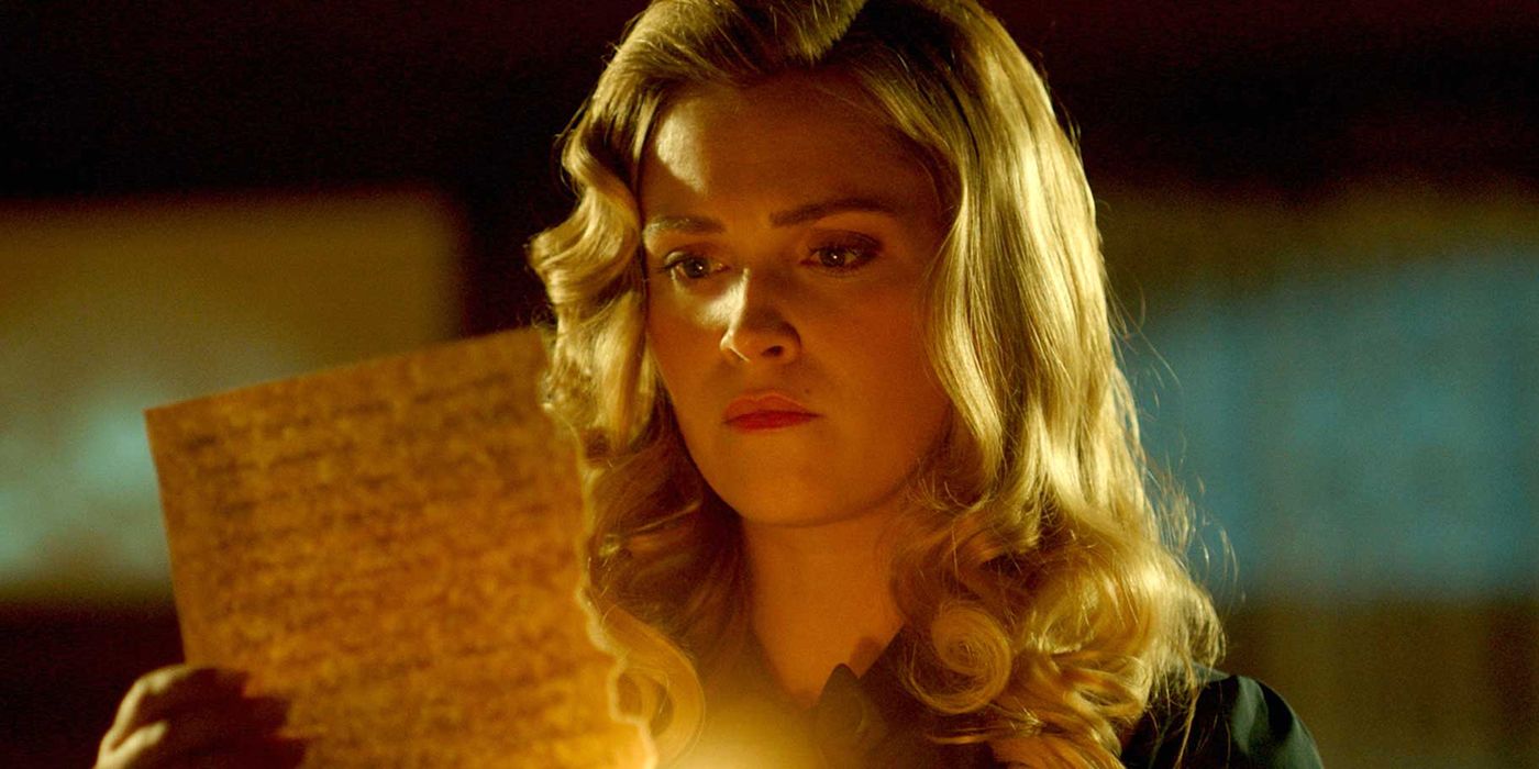 Eliza Taylor como Hannah queimando um papel na 2ª temporada de Quantum Leap