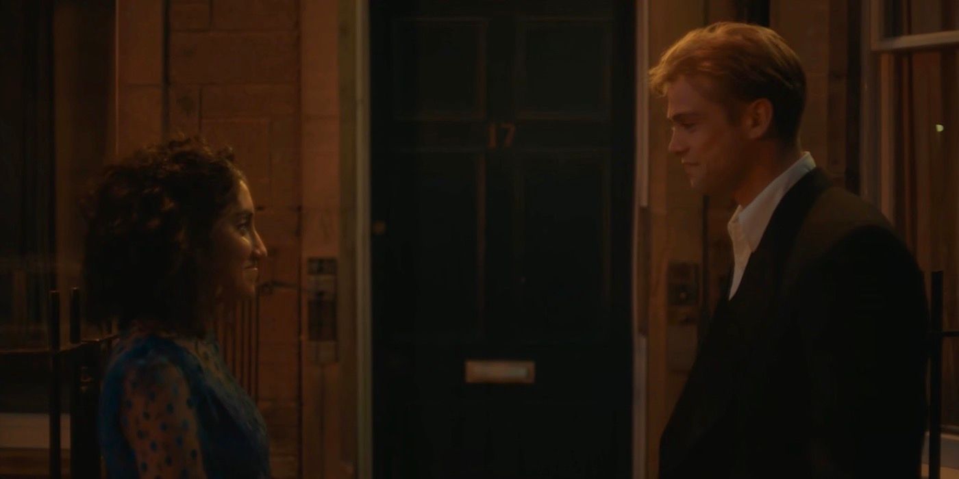 Emma and Dexter standing outside the door. 