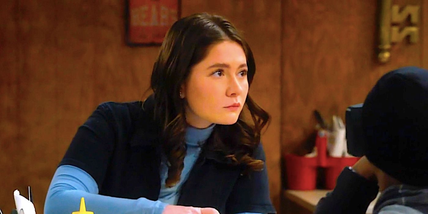 Emma Kenney's Harris looks up from a diner table in The Conners season 6 episode 1