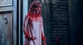 Enid (Emma Myers) looks heartbroken while covered in fake blood outside the Rave'N in Wednesday.