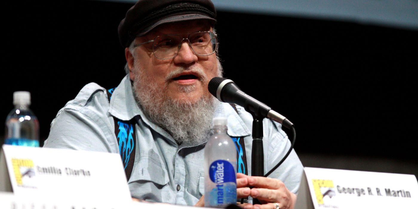 George R.R. Martin wearing a hat and speaking at San Diego Comic-Con