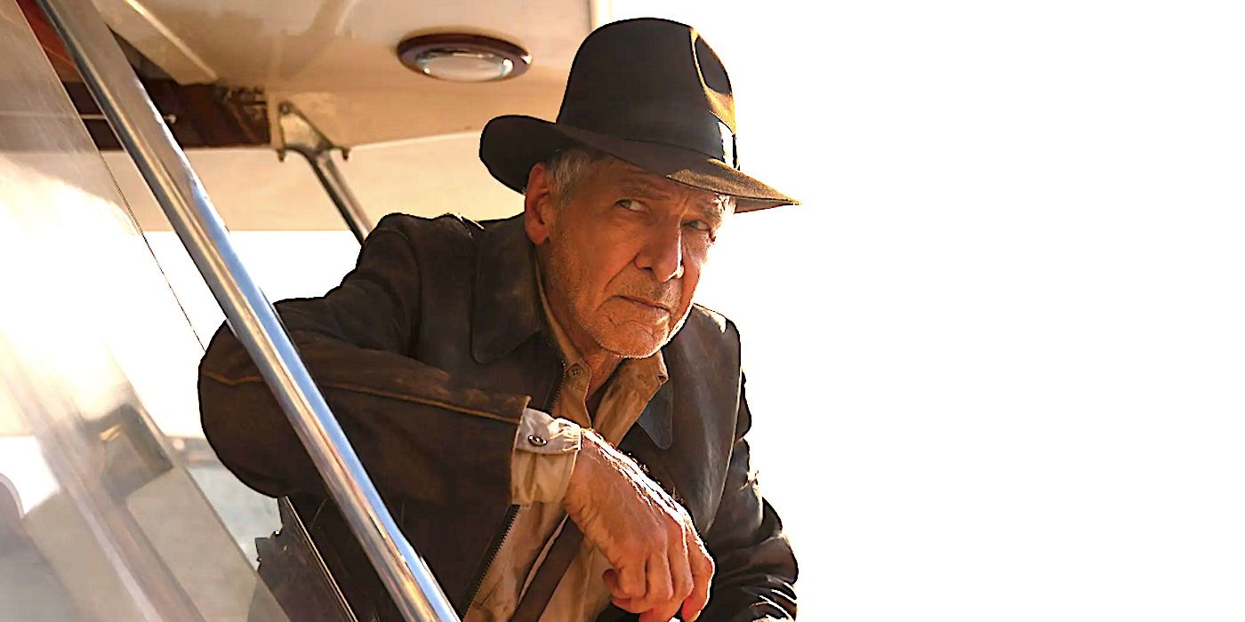 Harrison Ford's Indiana Jones frowns as he looks out a window in Dial of Destiny