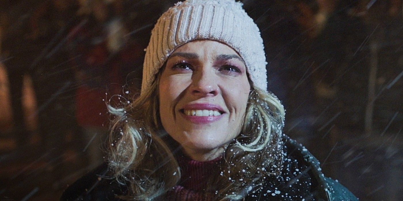 Hilary Swank smiling in the snow in Ordinary Angels