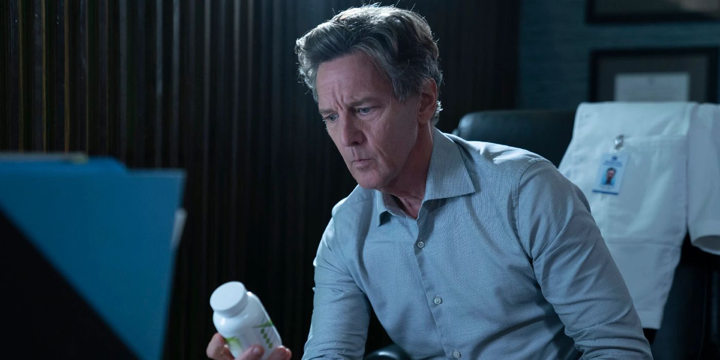 Ian Sullivan (Andrew McCarthy) looking at a bottle of pills in The Resident.