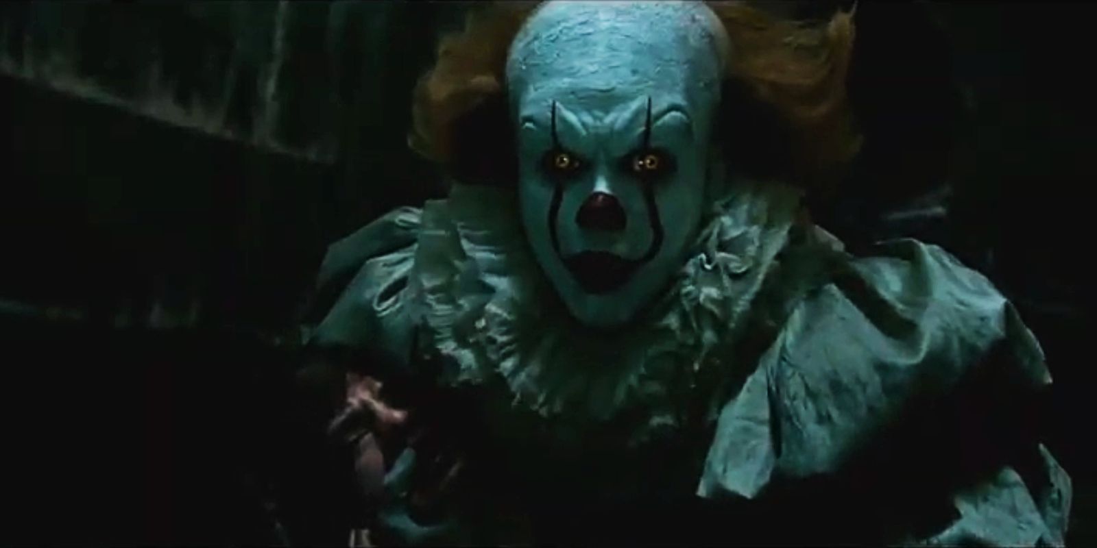 Pennywise holds his hand over Bill's mouth in IT's ending.
