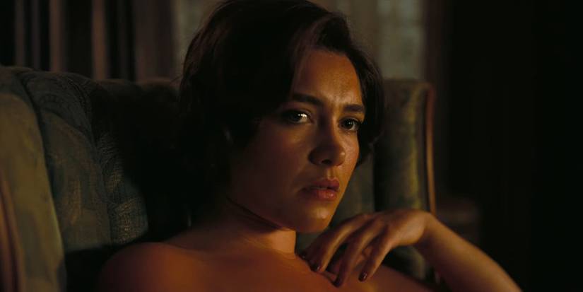 Florence Pugh as Jean Tatlock sitting naked in Oppenheimer