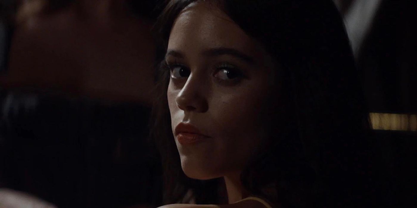 Jenna Ortega as Lorraine Day looks over her shoulder in a scene from X.