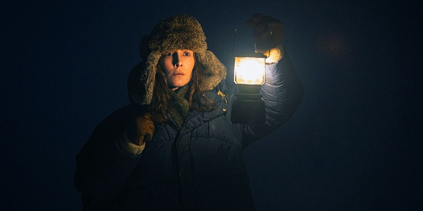 jo searching in the snow with a lantern