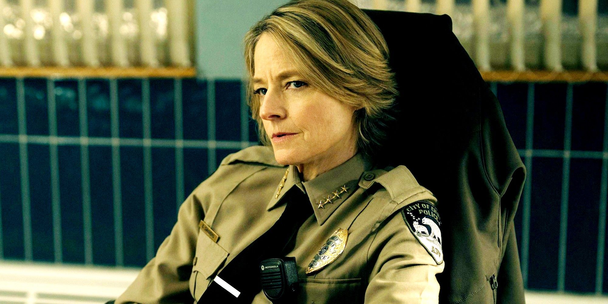 Jodie Foster in True Detective Season 4 sitting in a chair at her desk