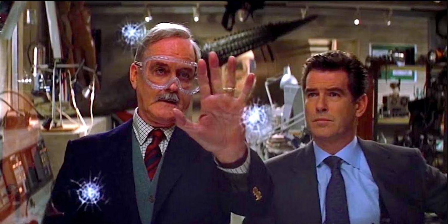 John Cleese as Q demonstrating to Pierce Brosnan as James Bond how the supersonic bulletproof glass-shattering ring works in Die Another Day.