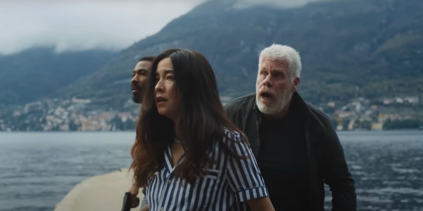 John (Donald Glover), Jane (Maya Erskine) and Toby (Ron Perlman) looking in awe in Mr. & _Mrs. Smith