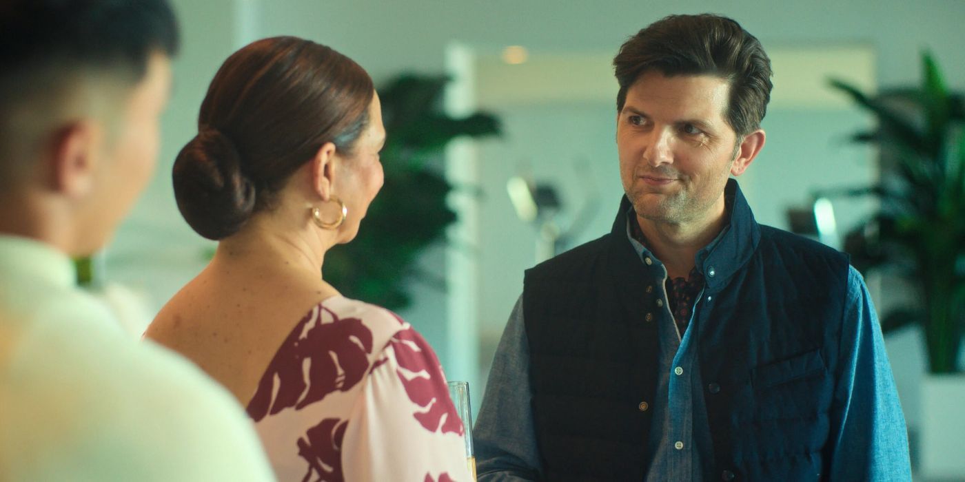 John Novak (Adam Scott) sonríe y charla con Molly (Maya Rudolph) en Lot.