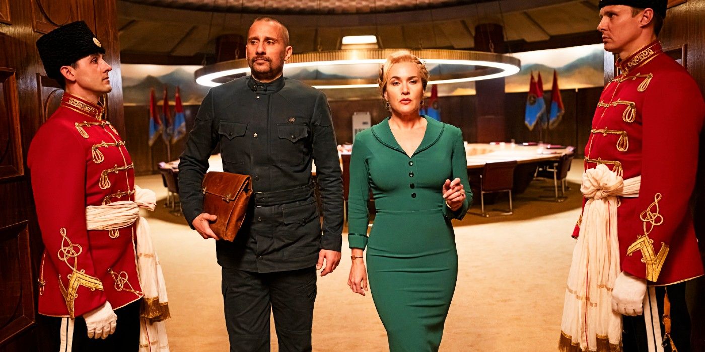 kate winslet and matthias schoenaerts walking out of a briefing room in the regime