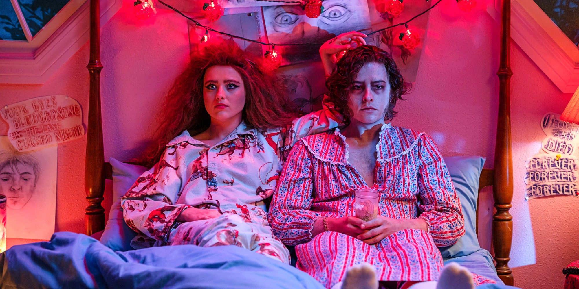 Kathryn Newton as Lisa Swallows and Cole Sprouse as The Creature sitting side by side in bed in Lisa Frankenstein