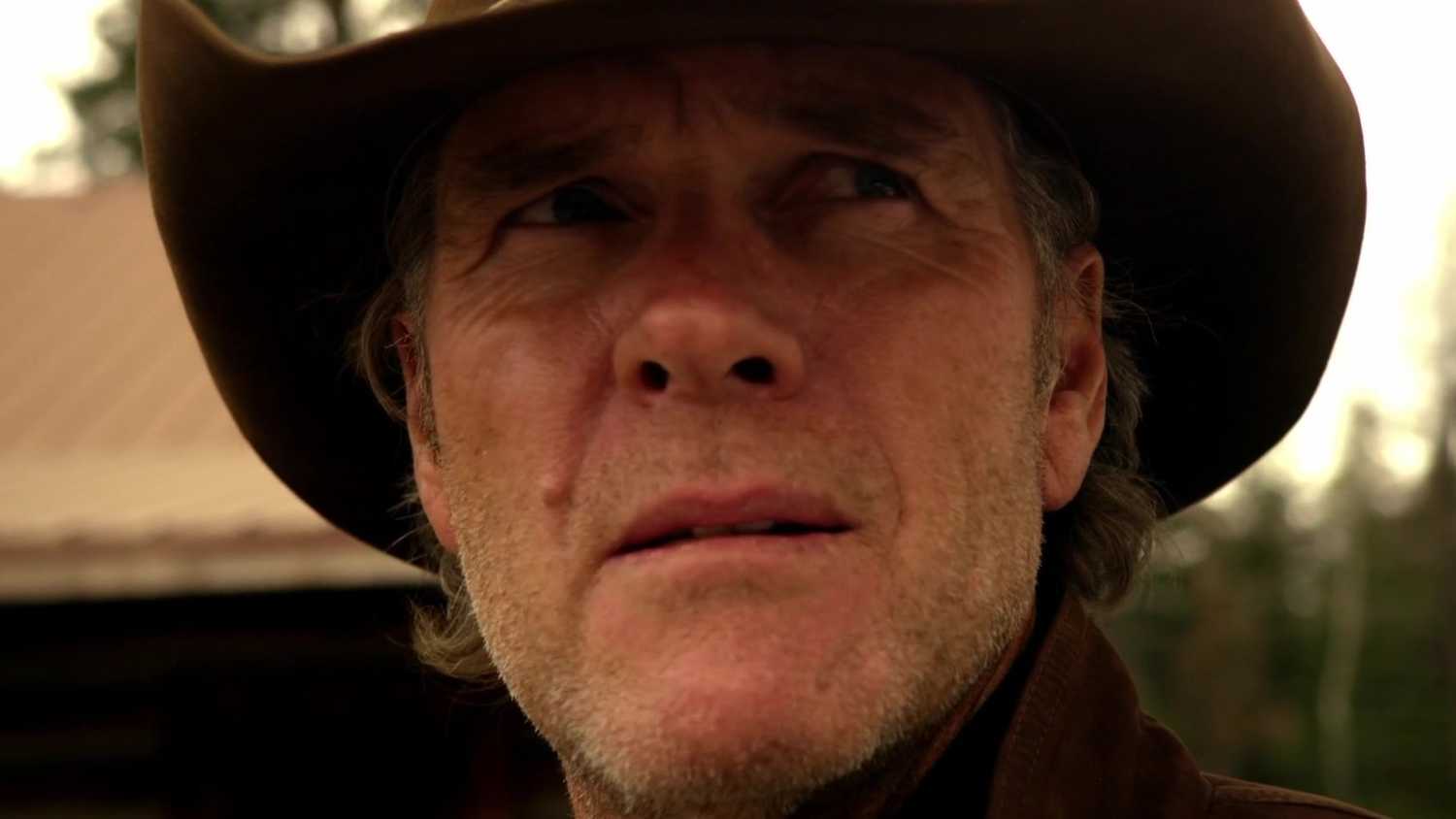 Robert Taylor as Walt Longmire hears a gunshot in Longmire season 3 episode 10