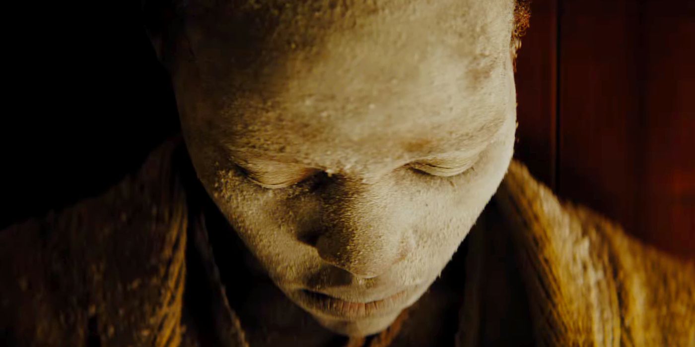 Lupita Nyong'o covered in dust in a scene from A Quiet Place: Day One.