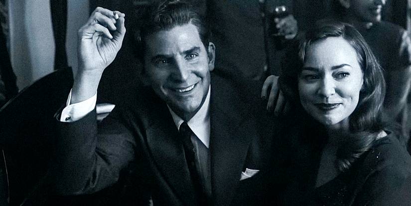 Bradley Cooper as Leonard Bernstein with Felicia Montealegre in Maestro smiling