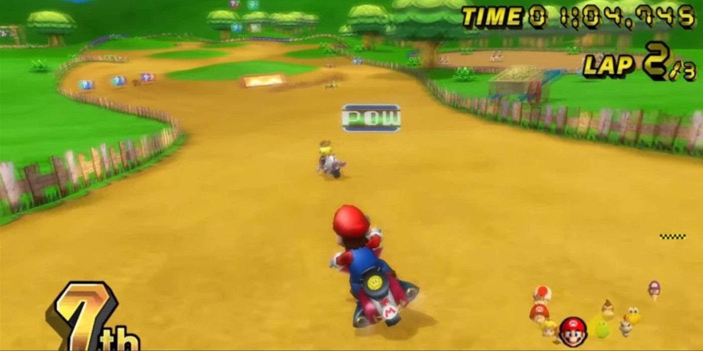 Mario driving in Moo Moo Meadows Mario Kart track with the Pow Box above him 