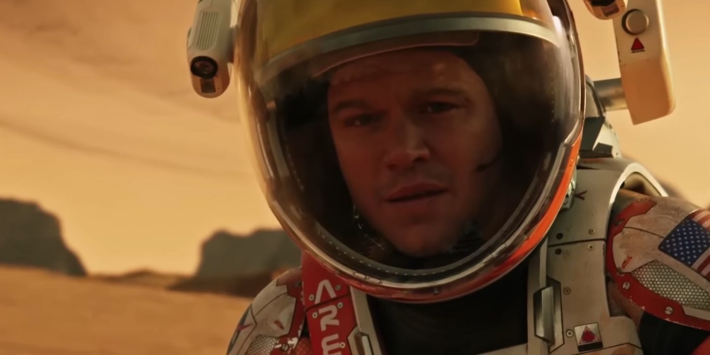 Mark Watney (Matt Damon) wearing a space suit and looking at the camera in The Martian.