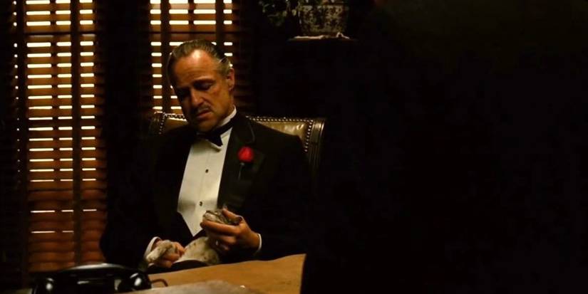 Marlon Brando holding a cat in The Godfather