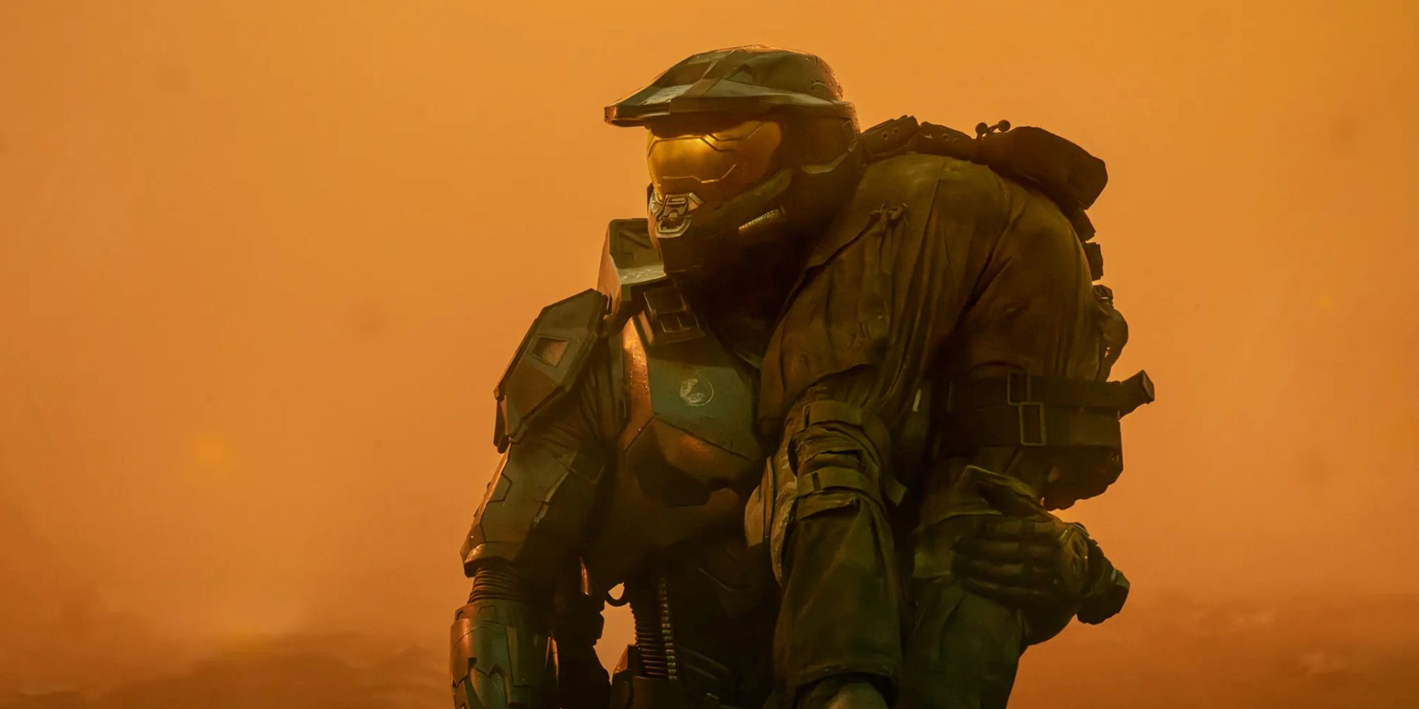 Master Chief (Pablo Schreiber) carries a wounded soldier in Halo season 2