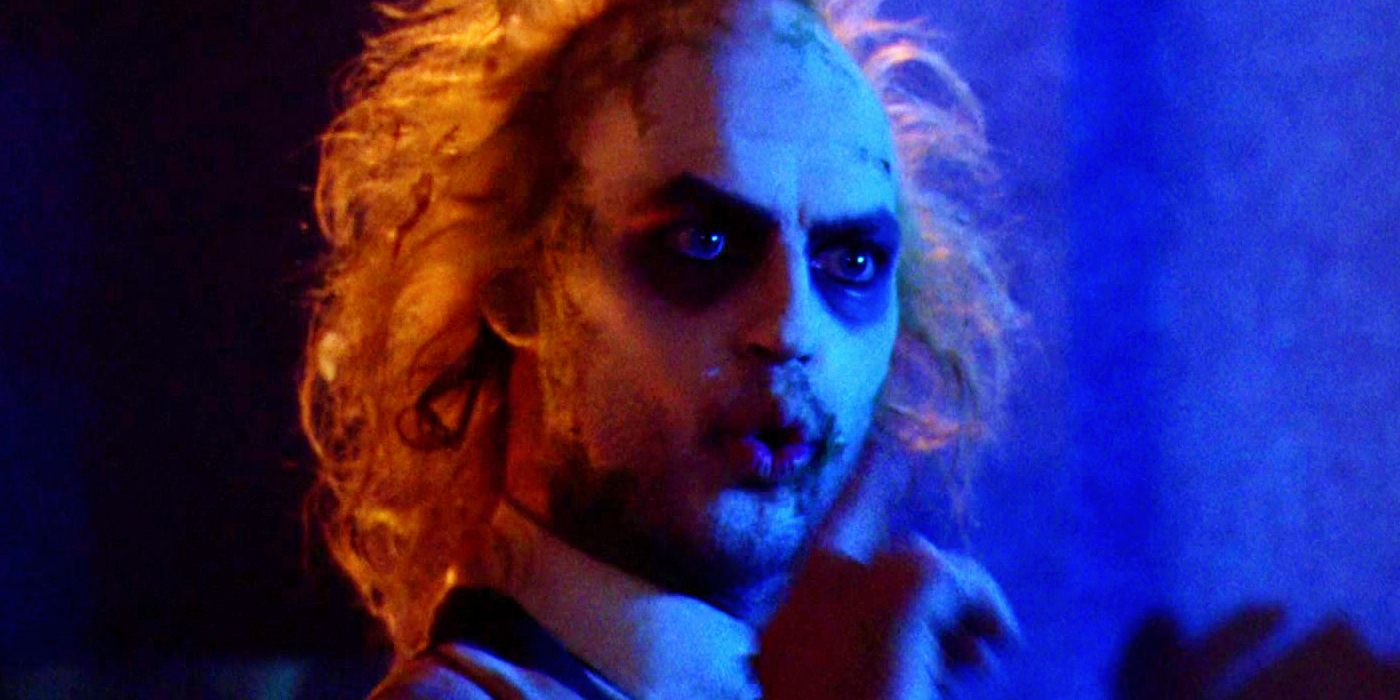 Michael Keaton as Betelgeuse Holding a Finger to His Lips in Beetlejuice