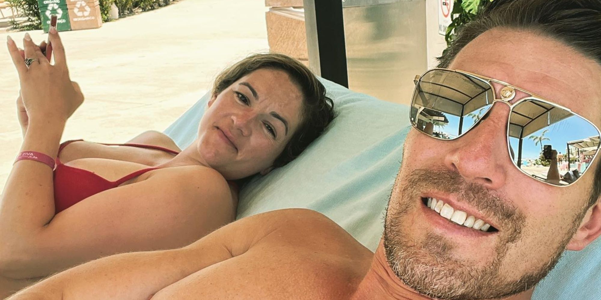 Seeking Sister Wife stars Garrick and Dannielle Merrifield posing for a cabana selfie