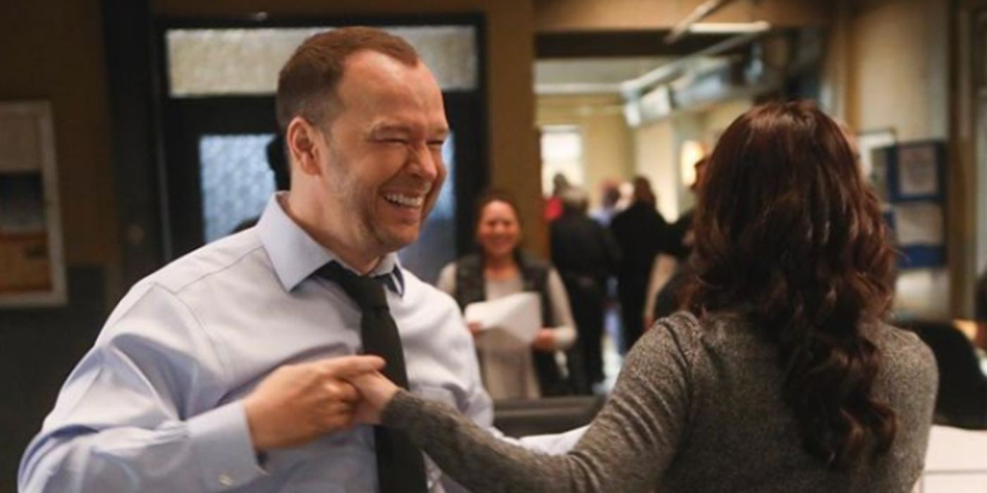 Danny (Donnie Wahlberg) and Baez (Marisa Ramirez) dancing in the office in Blue Bloods