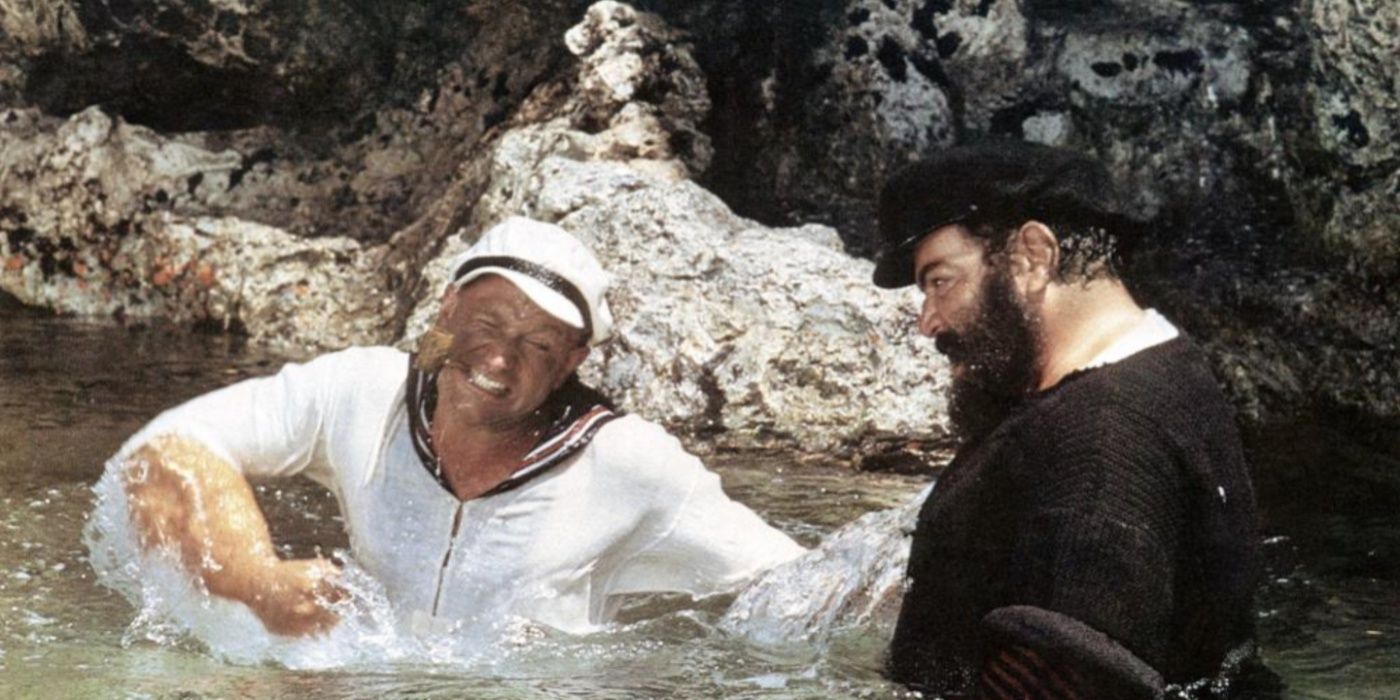 Popeye (Robin Williams) fighting in water in Popeye