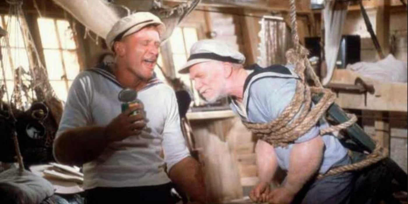 Popeye (Robin Williams) fighting in a boat in Popeye