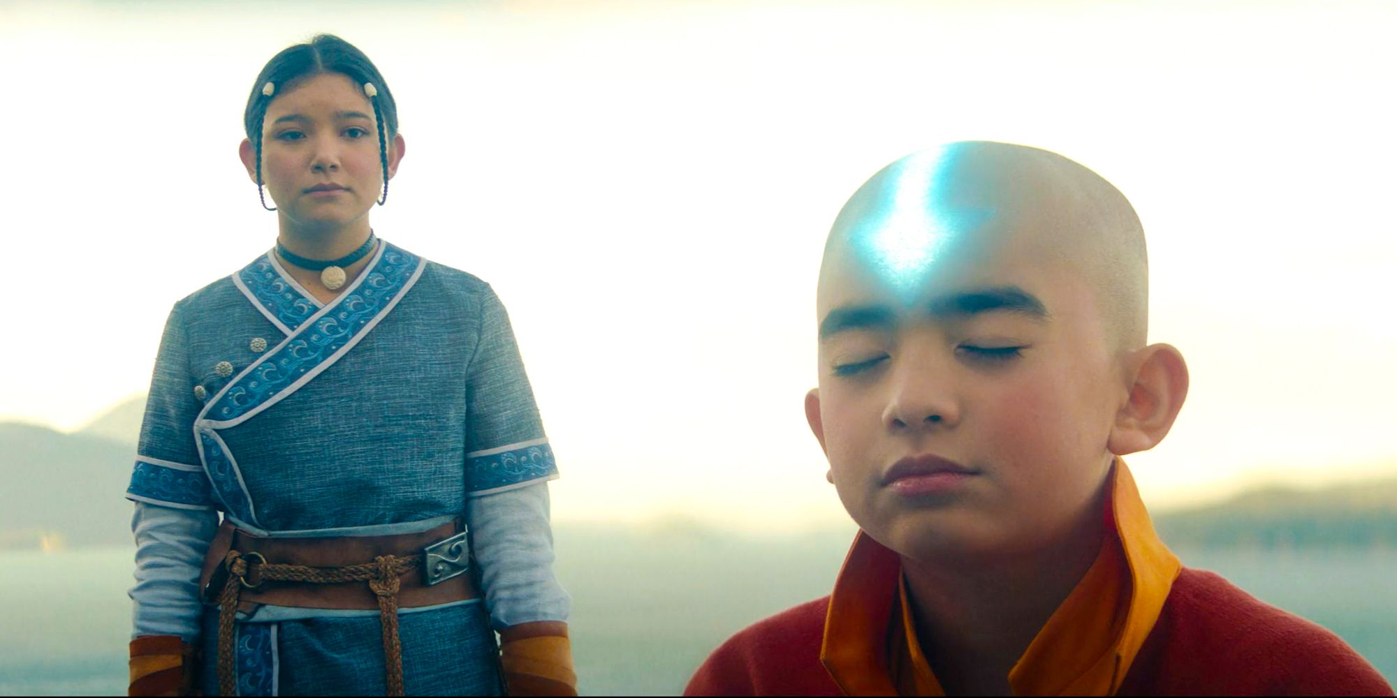 Katara and Aang from Avatar the last airbender avatar state arrow glowing Gordon Cormier as Aang Kiawentiio Tarbell as Katara