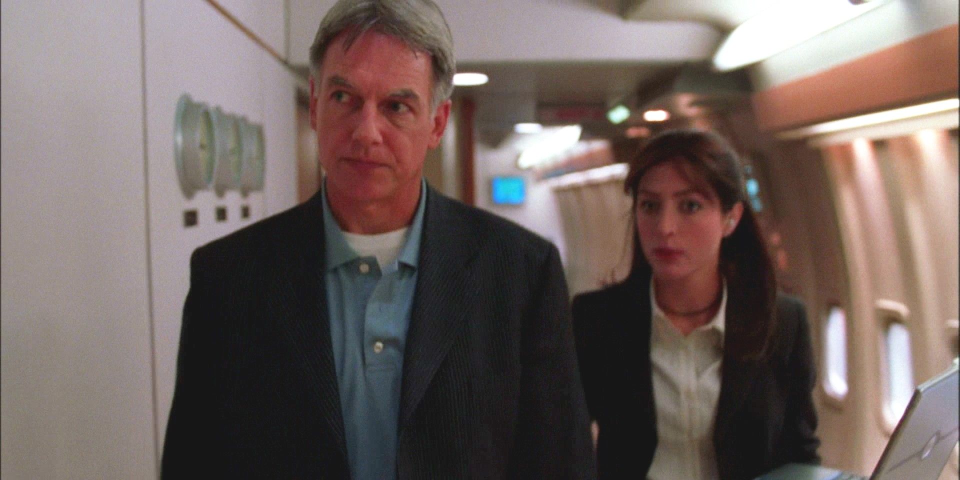 Leroy Jethro Gibbs and Caitlin Todd walk swiftly aboard Air Force One