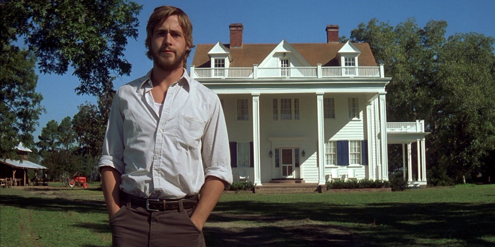 Noah standing in front of the house he built in The Notebook