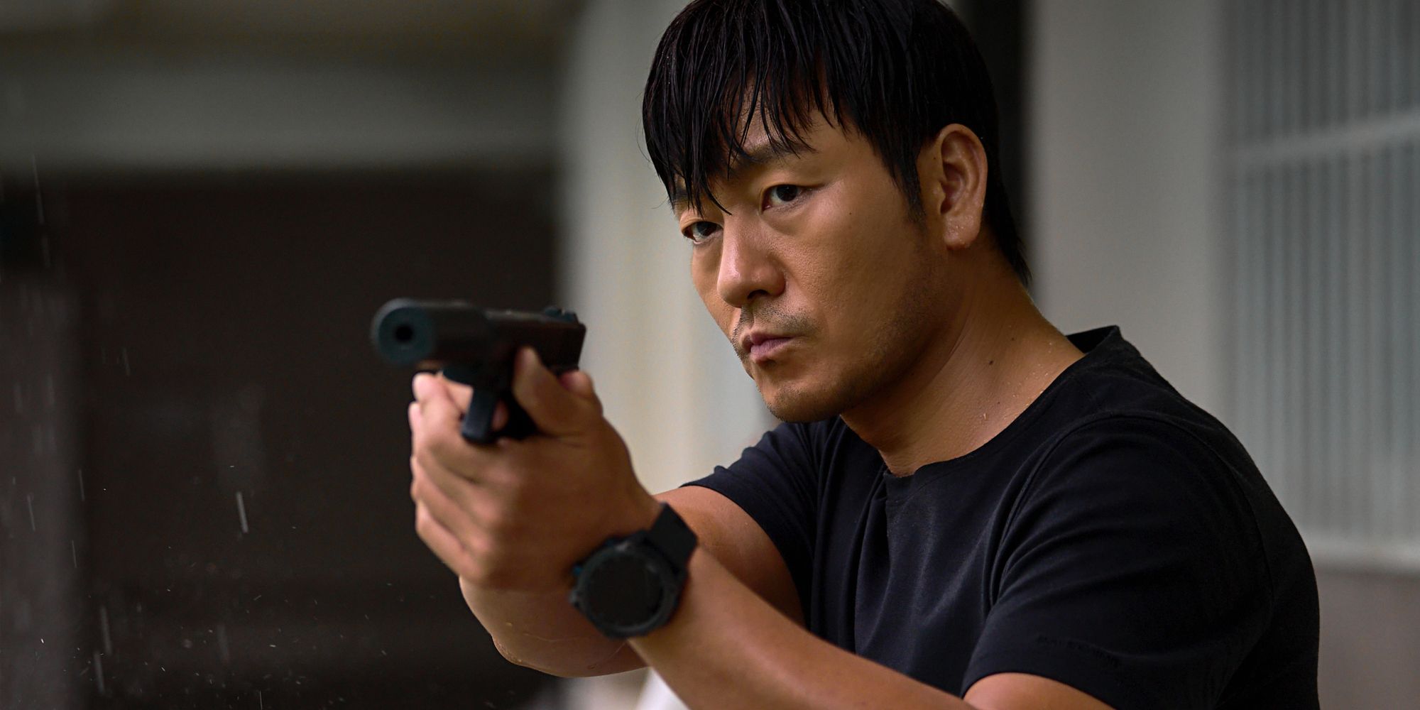 Park Hae-soo's character holding a gun in The Great Flood