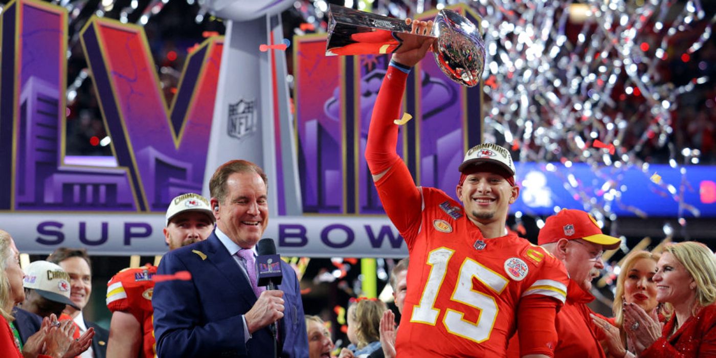 Patrick Mahomes holding up Super Bowl trophy in post game celebration
