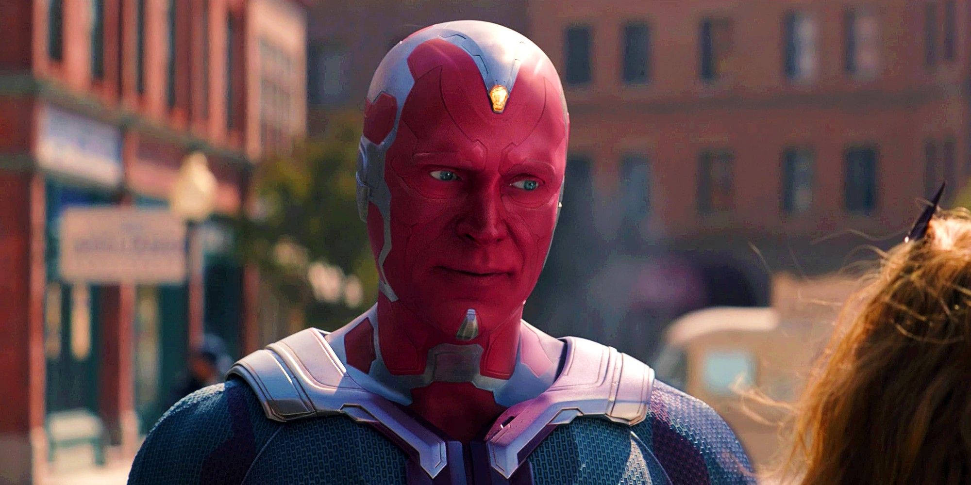 Paul Bettany as Vision In The Town Square Talking To Wanda In WandaVision