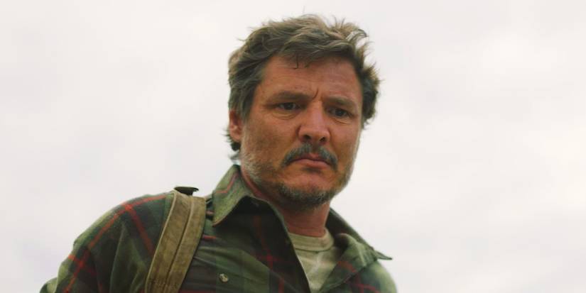 Pedro Pascal looking down, serious, as Joel in The Last of Us season 1