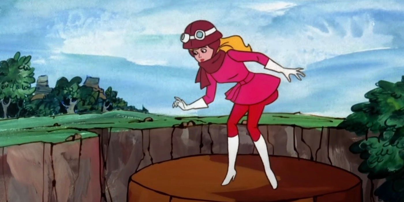 Penelope Pitstop is standing on top of a tower.  - A racer on the run from an enemy in disguise. - The Perils Of Penelope Pitstop (1969-1970)